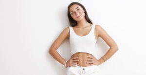 Happy Young Woman Wearing a White Casual Look on a White Background