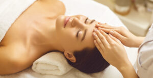 Facial massage to a beautiful girl in a top spa in Utah.