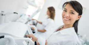 Several medical aestheticians smiling during their work.