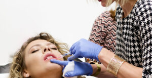 A woman getting lip injections.