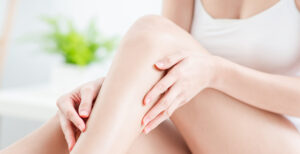 woman holding her leg that looks soft
