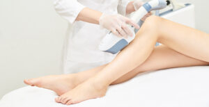 someone getting laser hair removal on their legs