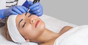 woman laying down as she is having a microblading treatment done.