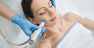 woman laying down and getting a HydraFacial done